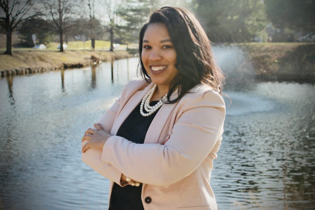 Photo of Owner in a light pink blazer